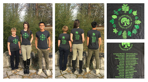 Front and back views of men's and women's dark grey Arboretum t-shirts with an inset of the front of the t-shirt featuring The Arboretum logo and 16 different tree leaves with a second inset of the back of the t-shirt featuring The Arboretum logo and the common name and the botanical name of the 16 tree leaves featured on the front of the t-shirt.