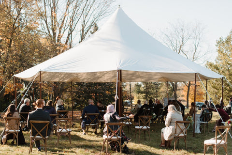 Conifer Site set up for a wedding ceremony with a rented tent